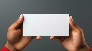 Close-up of female hands holding blank business card photo