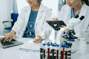 Scientist two woman with tablet and laptop, laboratory and ecofriendly science. Agriculture, research and scientists with online reading, test samples for global warming, analytics and tech. photo