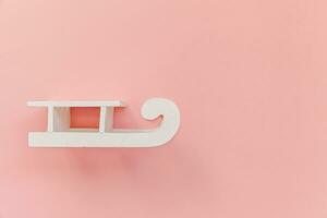 Simply minimal design composition white sled isolated on pink pastel colorful trendy background photo