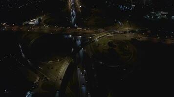 road junction with traffic flow at night video