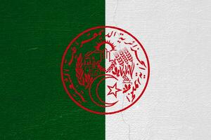 Flag and coat of arms of the Algerian People's Democratic Republic on a textured background. Concept collage. photo