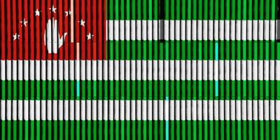 bandera de república de abjasia en un texturizado antecedentes. concepto collage. foto