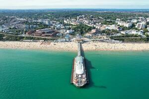 Aerial View of Most Beautiful and Attractive Tourist Destination at Bournemouth City Sandy Beach of England Great Britain, Image Was Captured with Drone's Camera on August 23rd, 2023 During sunny Day. photo