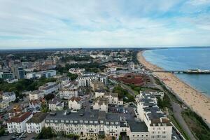 Aerial View of Most Beautiful and Attractive Tourist Destination at Bournemouth City Sandy Beach of England Great Britain, Image Was Captured with Drone's Camera on August 23rd, 2023 During sunny Day. photo