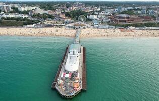 Aerial View of Most Beautiful and Attractive Tourist Destination at Bournemouth City Sandy Beach of England Great Britain, Image Was Captured with Drone's Camera on August 23rd, 2023 During sunny Day. photo