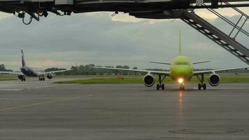 NOVOSIBIRSK, RUSSIAN FEDERATION JUNE 14, 2019 - Airbus 319 S7 Airlines VP BHG taxiing on the apron after landing, early morning. video