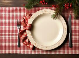 A plate with decorations on white table for christmas time photo