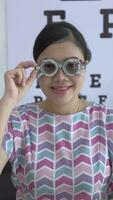 Eye check, optical glasses, eye test, woman eye check in optometry clinic video