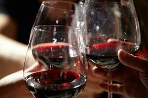 Three red wine glasses. photo