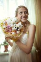 Beautiful young bride with a wedding bouquet photo