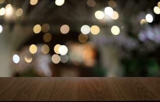 Empty wooden table in front of abstract blurred background of coffee shop . can be used for display or montage your products.Mock up for display of product photo