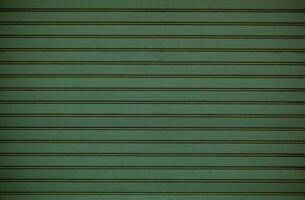 Green wooden wall cladding background texture photo