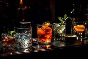 Cocktail party, alcohol drinks with gin, whiskey, vermouth and liquor, black bar counter background, nightlife atmosphere. photo
