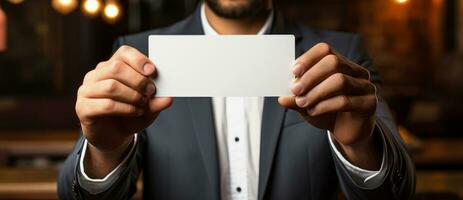 Close up of businessman hand showing business card photo