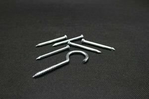 Hanger nails on a black background photo