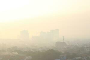 The view of the sunrise in the middle of the city seen from above, photo