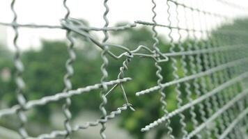 Broken iron wire fence over highway photo