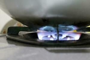 Flame on a burning gas stove photo