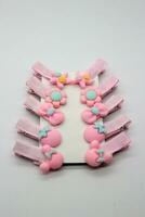 A set of pink hair clips photo