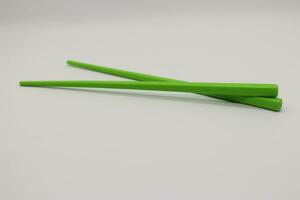 Chopsticks with white background photo