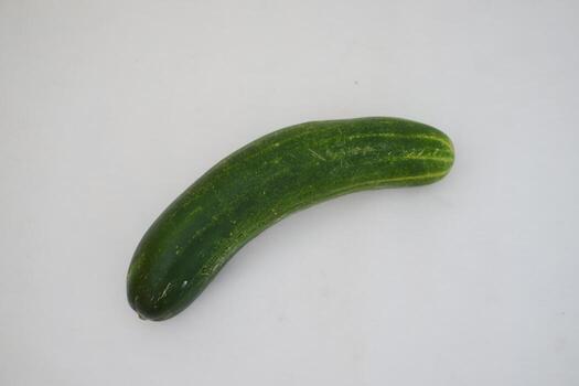 Cucumber and slices on a white background. Selective focus. photo