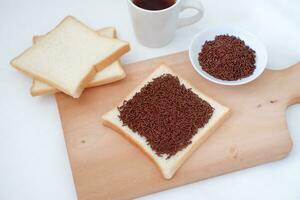 Sandwich with chocolate and coffee on a wooden board, stock photo