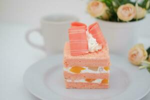 Slice of cake on white marble background. Selective focus. photo