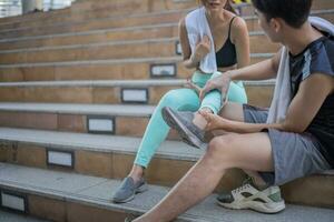 Fitness sport people exercising and lifestyle concept. Couple running upstairs on city stairs. photo