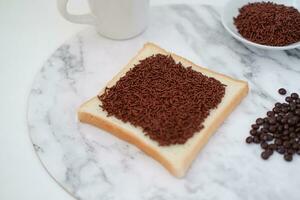 Sandwich with chocolate and coffee on a wooden board, stock photo