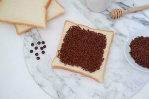 Sandwich with chocolate and coffee on a wooden board, stock photo