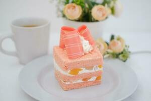 Slice of cake on white marble background. Selective focus. photo