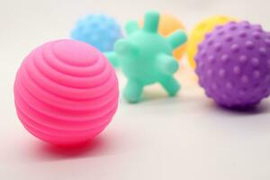 Collection of small rubber ball toys of various colors photo