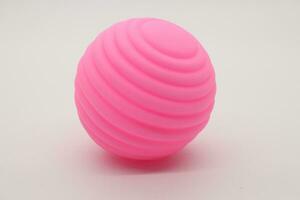 Small pink rubber ball toy photo