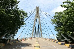View of the sea crossing bridge with clear clouds photo