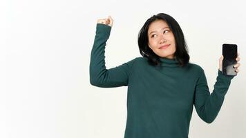 Holding Smartphone with yes happy smile gesture and showing blank Screen Of Beautiful Asian Woman Isolated On White Background photo