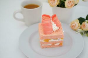 Slice of cake on white marble background. Selective focus. photo