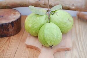 guava fruit on wood background photo