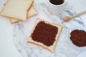 Sandwich with chocolate and coffee on a wooden board, stock photo