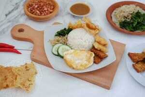 Thai food with rice, fried tofu, shrimp paste, sweet and sour sauce photo