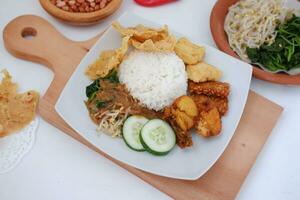 Nasi lemak, Indonesian food with rice and fried chicken photo