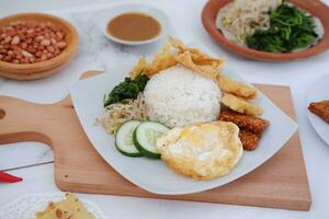 Thai food with rice, fried tofu, shrimp paste, sweet and sour sauce photo