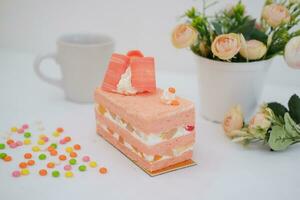 Slice of cake on white marble background. Selective focus. photo