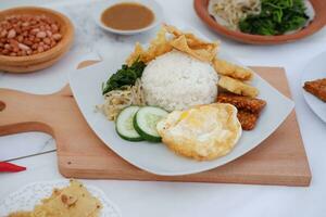 Thai food with rice, fried tofu, shrimp paste, sweet and sour sauce photo