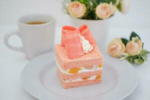 Slice of cake on white marble background. Selective focus. photo