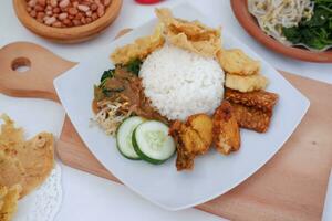 Nasi lemak, Indonesian food with rice and fried chicken photo