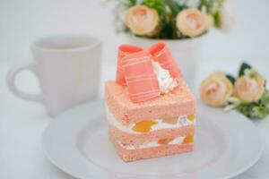 Slice of cake on white marble background. Selective focus. photo