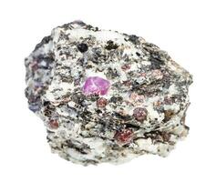 ruby and corundum crystals in rough gneiss rock photo