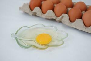 Eggs in a carton box on a white background. photo