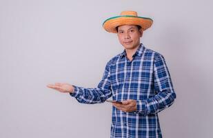 Asian farmer wearing striped shirt photo