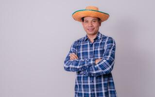 Asian farmer wearing striped shirt photo